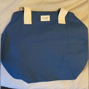 Octobre Editions Bowling Duffel Bag, Blue with white handles